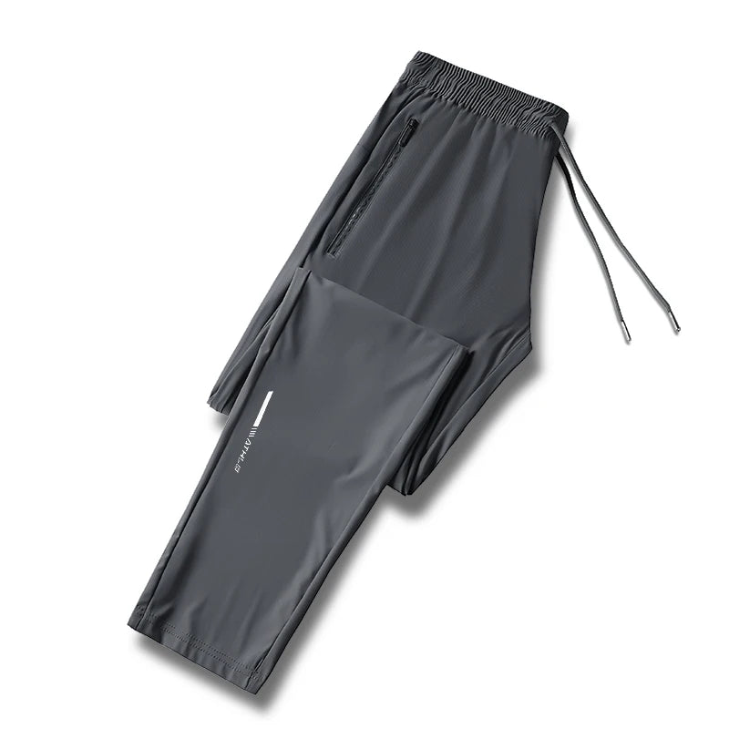 Men's solid color pants summer ice silk elastic quick drying/loose sports pants suitable for casual and business wear M-8XL