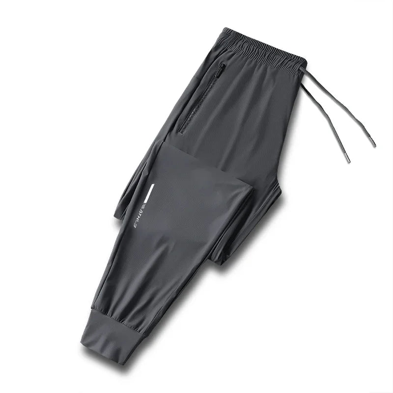 Men's solid color pants summer ice silk elastic quick drying/loose sports pants suitable for casual and business wear M-8XL