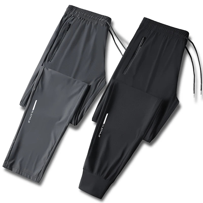 Men's solid color pants summer ice silk elastic quick drying/loose sports pants suitable for casual and business wear M-8XL
