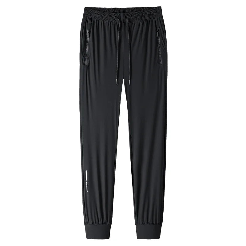 Men's solid color pants summer ice silk elastic quick drying/loose sports pants suitable for casual and business wear M-8XL