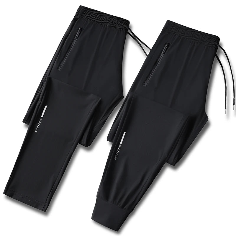 Men's solid color pants summer ice silk elastic quick drying/loose sports pants suitable for casual and business wear M-8XL